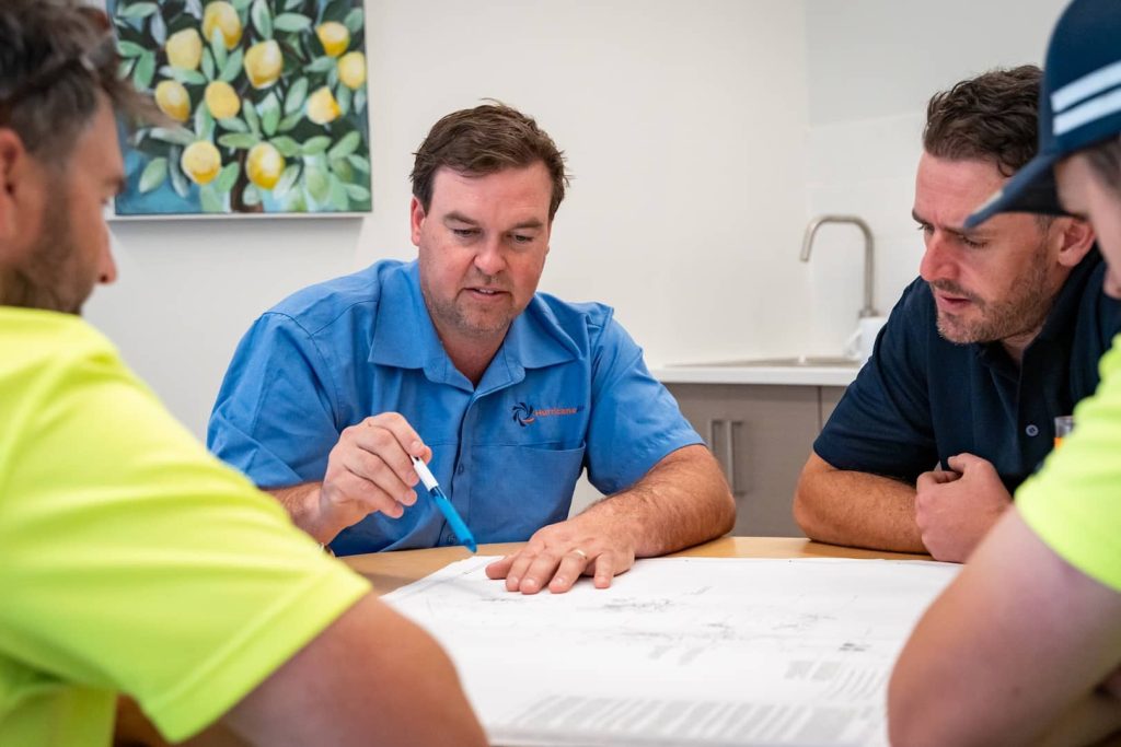 technicians discussing emergency cool room services